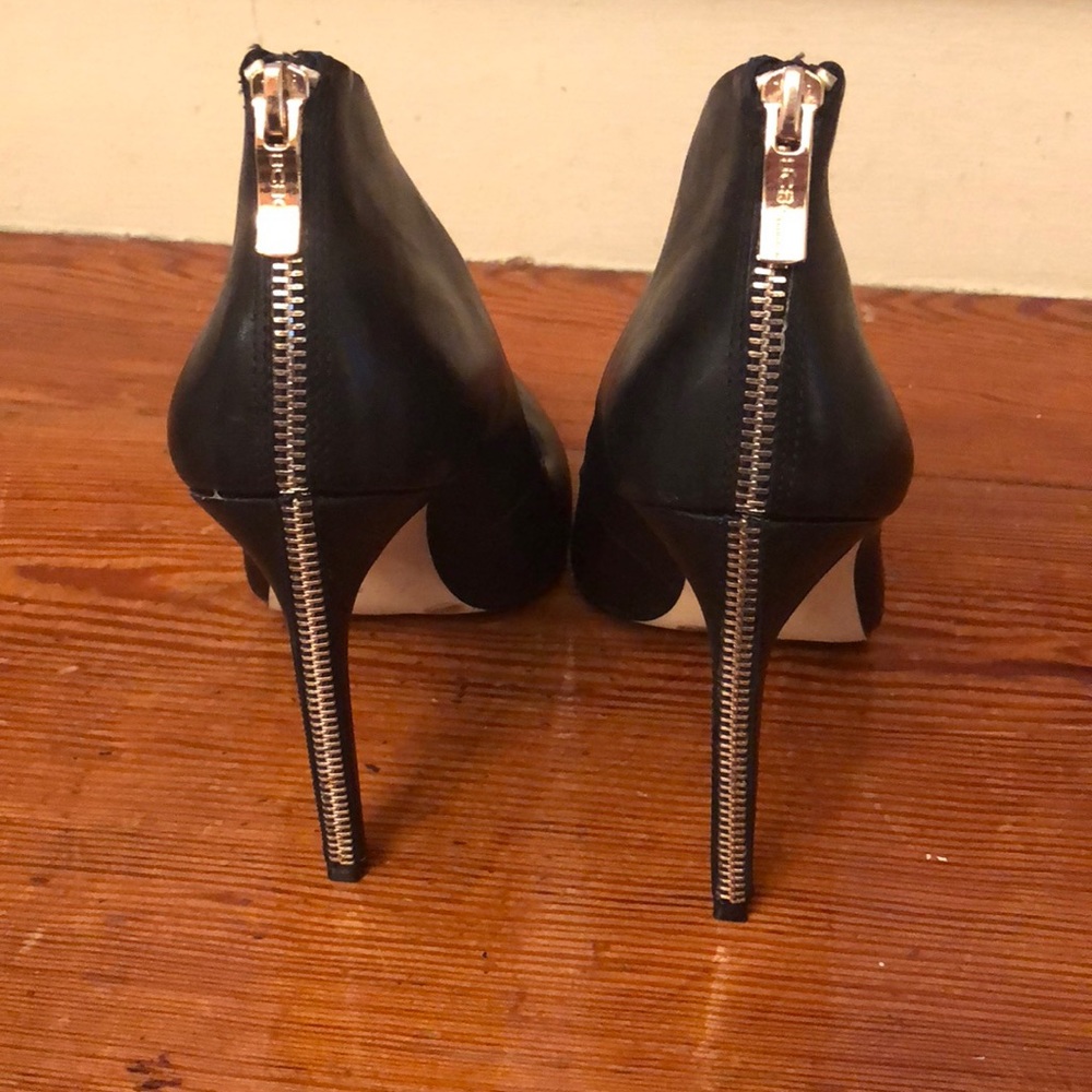 Black leather pumps